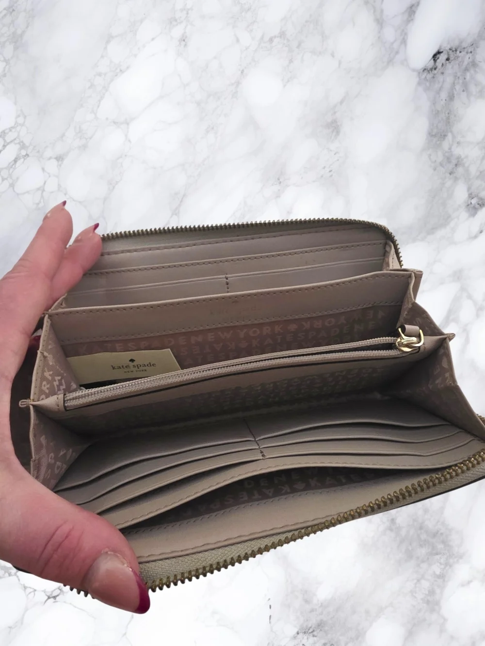 kate spade Rose Gold Zip-around wallet with gold plaque